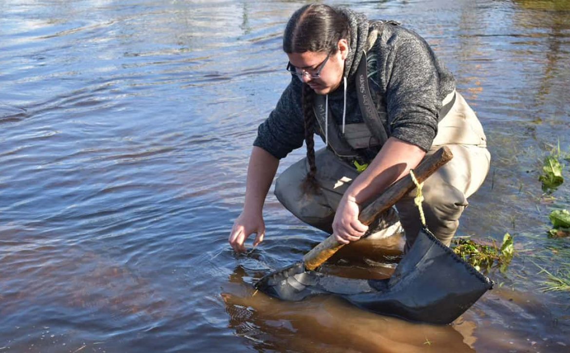 photo of indigenous man fishing