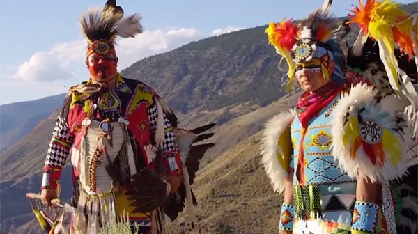 photo of two northern cree dancers in BC mountains