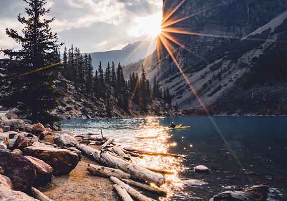 photo of sun burst over mountain